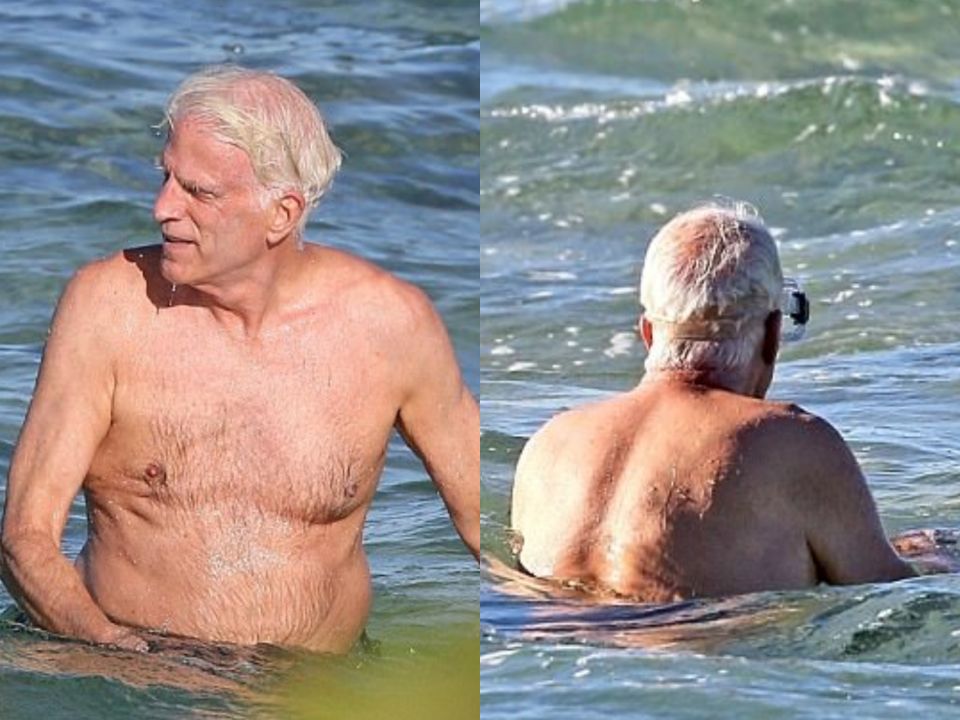 Ted Danson's bald patch seen in the water.