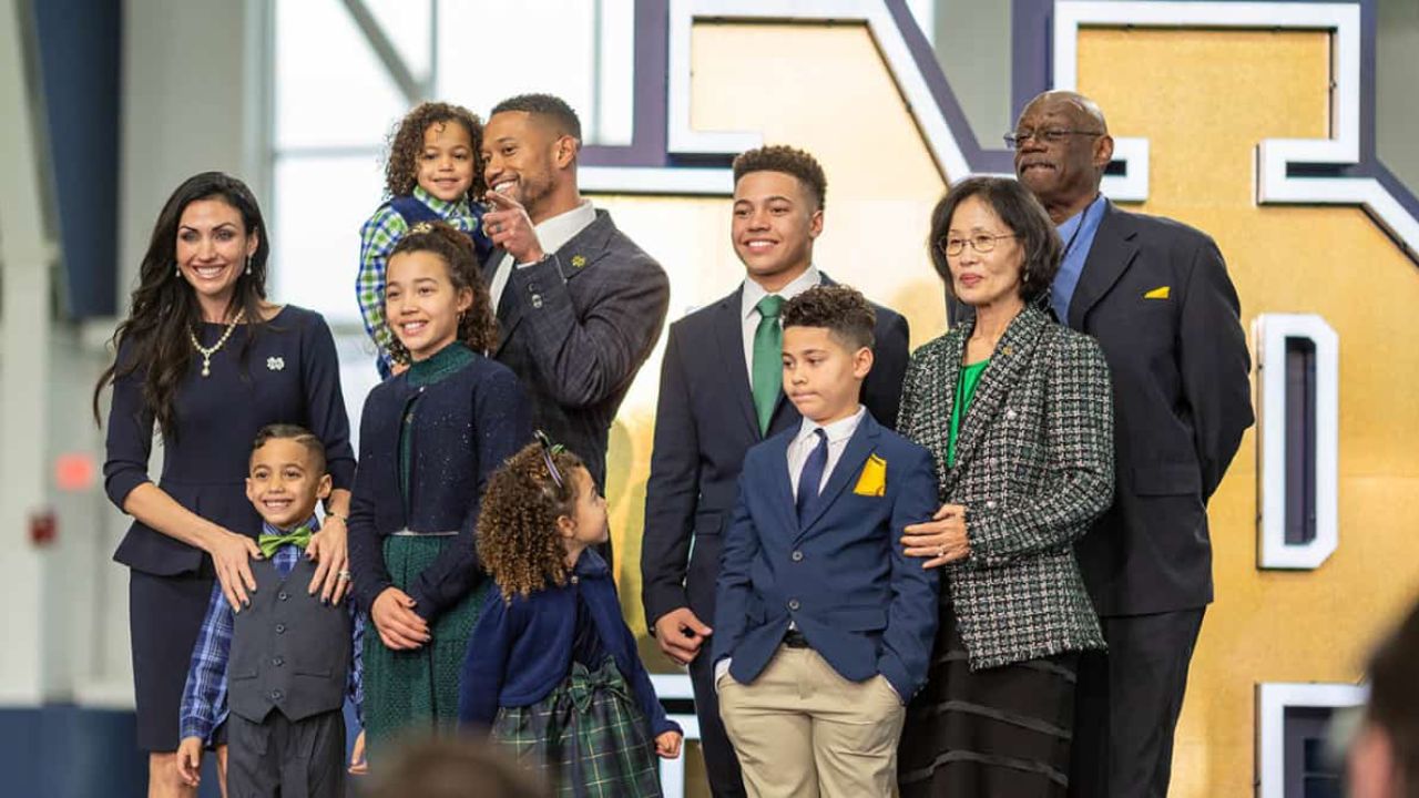 Marcus Freeman with his family; his parents (Korean mother and Black father) are on the right.